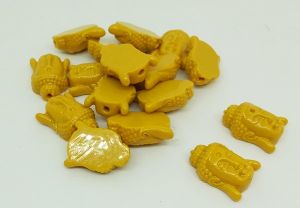 Synthetic coral beads, Buddha, Mustard Yellow