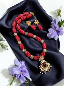Synthetic coral carved beads with Victorian pendant with matching earrings , Red