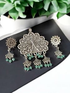 Oxidised pendant with Crystals and charms Drop and matching earrings , Sliver