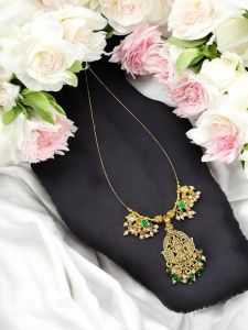 Invisible necklace with jadau charms and antique gold pendant 