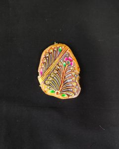 Onyx Pendant Features a Tanjore Painting on Onyx Stones Detailed with Gold Foil Borders