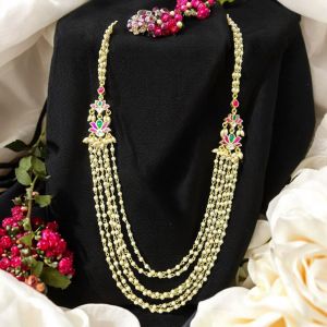 Jadau charms as side connector with pearl chains