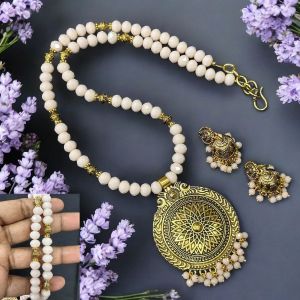 Opaque Crystals with Antique Gold pendant Necklace with Jhumkas Light Biege