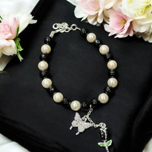 Swarovski replica pearl and black agate bracelet with butterfly and tulip charms