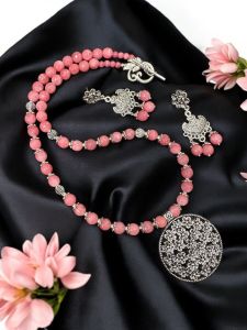 Pinkish peach agates with oxidised silver flower pendant with matching earrings