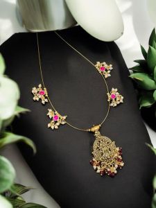 Invisible necklace with jadau charms and antique gold pendant 