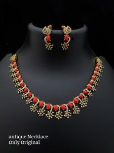 Coral Vaibhavi : Elegant coral color necklace with American diamond stones
