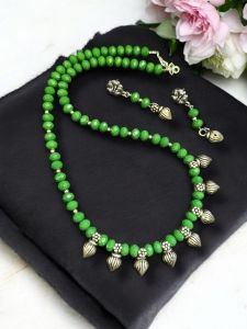 Green Crystal Necklace With Kohlapuri Charms    