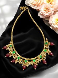 Golden pearl with jadau Kundan charms 