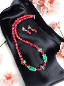 Onyx Beads with synthetic coral carved rose beads with German silver spacers with a matching earrings Cherry red
