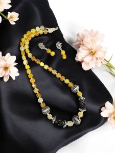 Onyx Beads with synthetic coral carved rose beads with German silver spacers with a matching earrings Yellow