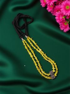 Mother of pearl chips in 2 layers with Victorian spacers in a black cotton Dori