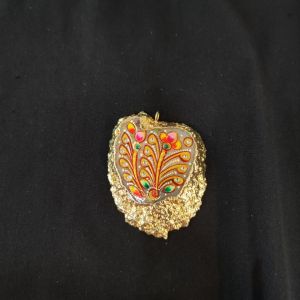 Onyx Pendant features a Tanjore painting on Onyx Stones detailed with gold foil borders