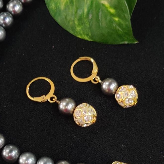 Blue pearl flower dangler antique golden earrings at ₹950 | Azilaa